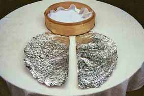 Join two parts of aluminium foil to cover the lid